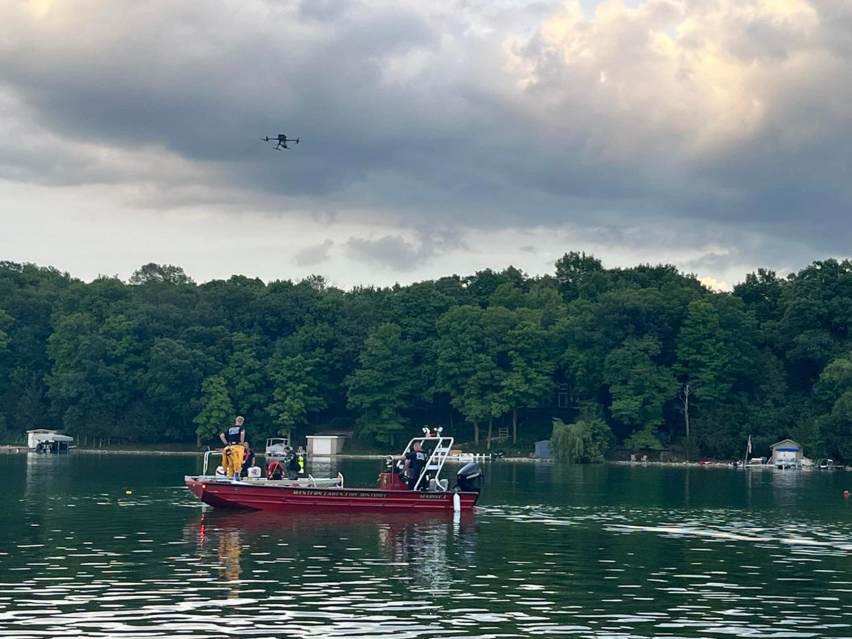 Rescue and recovery crews search for a man who fell out of a kayak on Lower Nemahbin Lake in the village of Summit on Tuesday, Aug. 1, 2023. Searchers were unable to locate his body Tuesday evening in a search that carried into the next day.