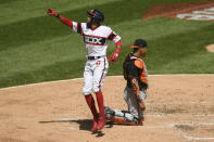 Chicago White Sox's Billy Hamilton, left, celebrates at home plate after hitting a solo home run during the third inning of a baseball game against the Baltimore Orioles, Sunday, May 30, 2021, in Chicago. (AP Photo/Paul Beaty)