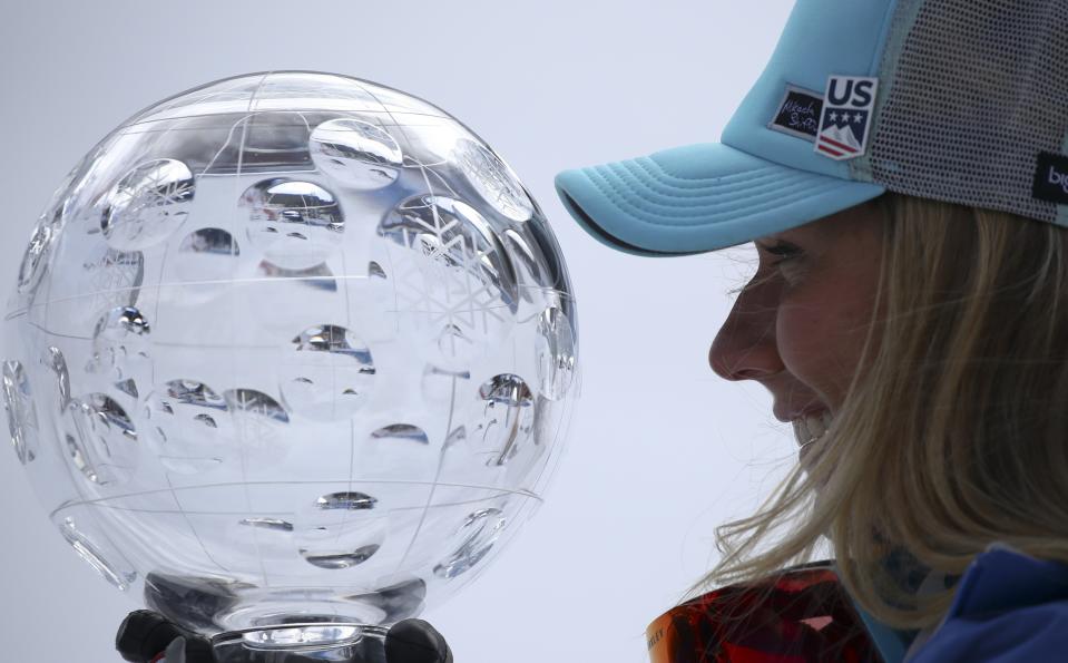 United States' Mikaela Shiffrin holds the women's World Cup overall trophy at the alpine ski, World Cup finals in Soldeu, Andorra, Sunday, March 17, 2019. (AP Photo/Alessandro Trovati)