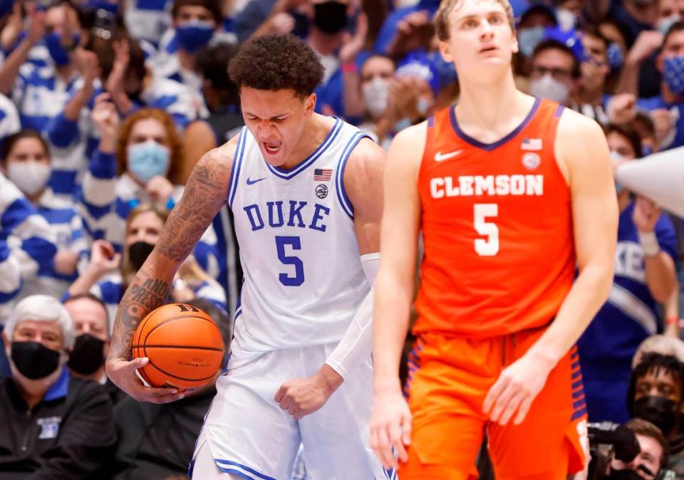 Duke’s Paolo Banchero (5) celebrates after pulling in the rebound while being fouled late in the second half of Duke’s 71-69 victory over Clemson at Cameron Indoor Stadium in Durham, N.C., Tuesday, January 25, 2022. Clemson’s Hunter Tyson (5) is to the right.