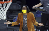 California head coach Charmin Smith talks with an official during an NCAA college basketball game in the first round of the Pac-12 women's tournament Wednesday, March 3, 2021, in Las Vegas. (AP Photo/Isaac Brekken)