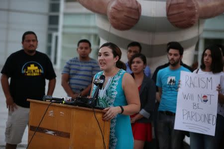 Alex Gomez of Living United for Change in Arizona (LUCHA) joins local immigrants rights organizations to protest in Phoenix, Arizona, U.S. August 25, 2017, after former Arizona sheriff Joe Arpaio was pardoned by U.S. President Trump. REUTERS/Caitlin O'Hara