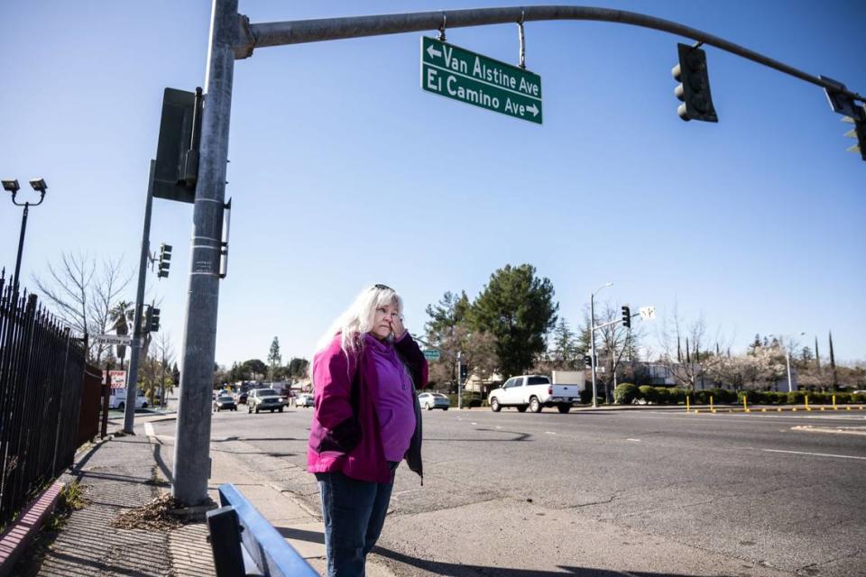 Lisa Wiley gets emotional in February while standing at the intersection where her son, Robert Jenson, was killed in by a hit-and-run driver in 2022. Hector Amezcua/hamezcua@sacbee.com