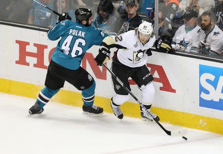 Pittsburgh Penguins left wing Carl Hagelin (62) battles for the puck with San Jose Sharks defenseman Roman Polak (46) in the second period of game six of the 2016 Stanley Cup Final at SAP Center at San Jose. Mandatory Credit: John Hefti-USA TODAY Sports