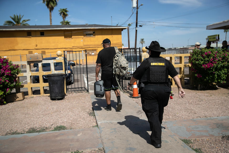 Maricopa County constable Darlene Martinez evicts a tenant on October 7, 2020 in Phoenix, Arizona. Thousands of court-ordered evictions continue nationwide despite a Centers for Disease Control (CDC) moratorium for renters impacted by the coronavirus pandemic. (John Moore/Getty Images)