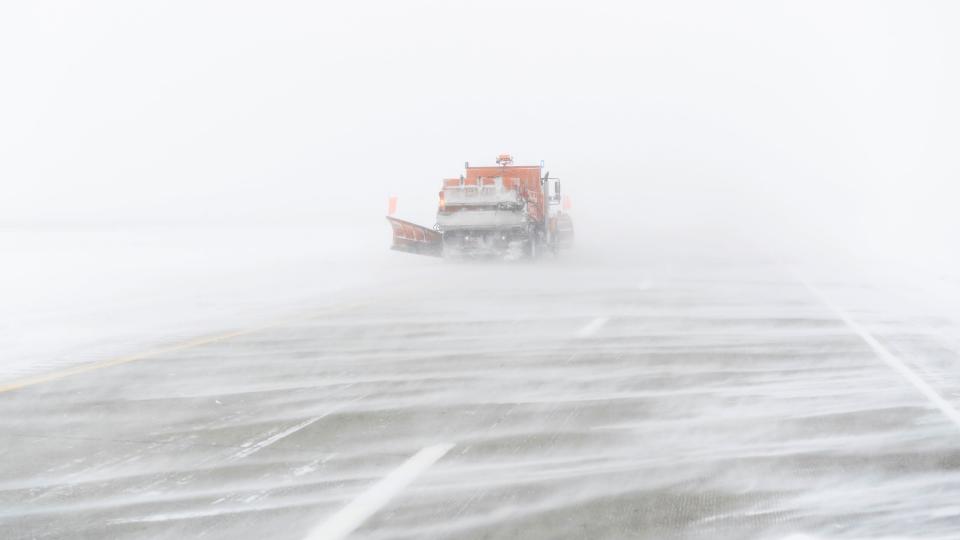 A snow plow moves along the snow-streaked, eastbound lane of US Highway 20 during a blizzard near Holstein, Iowa, Saturday, Jan. 13, 2024. (AP Photo/Carolyn Kaster) ORG XMIT: IACK102