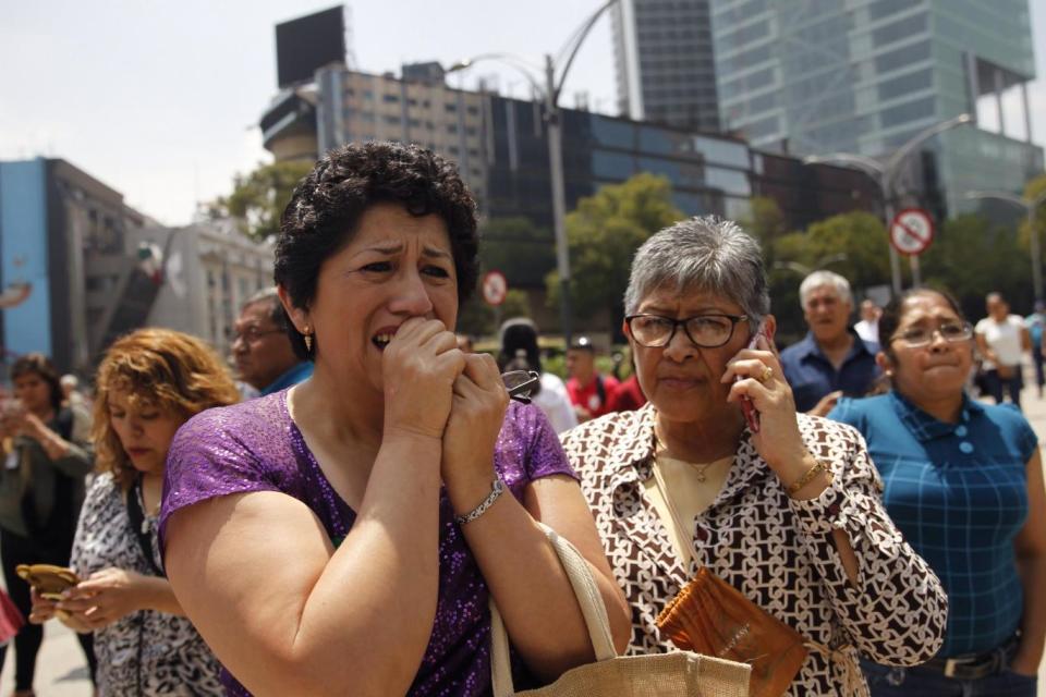 People leave buildings following a magnitude 7.1 earthquake on the Richter scale, in Mexico City (EPA)