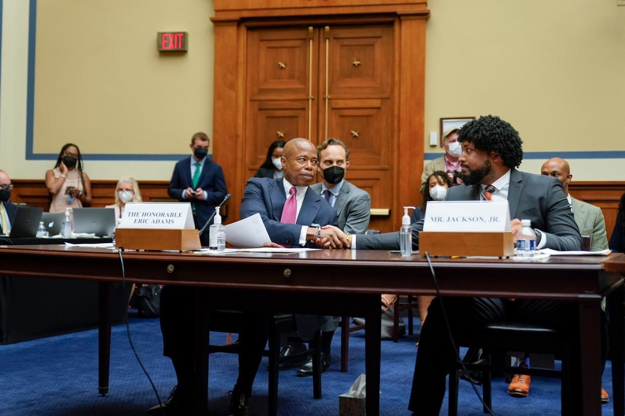 New York City Mayor Eric Adams (left) shakes hands with Greg Jackson, Jr., executive director of Community Justice Action Fund (right) after they testified during a House Committee on Oversight and Reform hearing on gun violence on Capitol Hill in Washington, D.C. on Wednesday, June 8, 2022. 