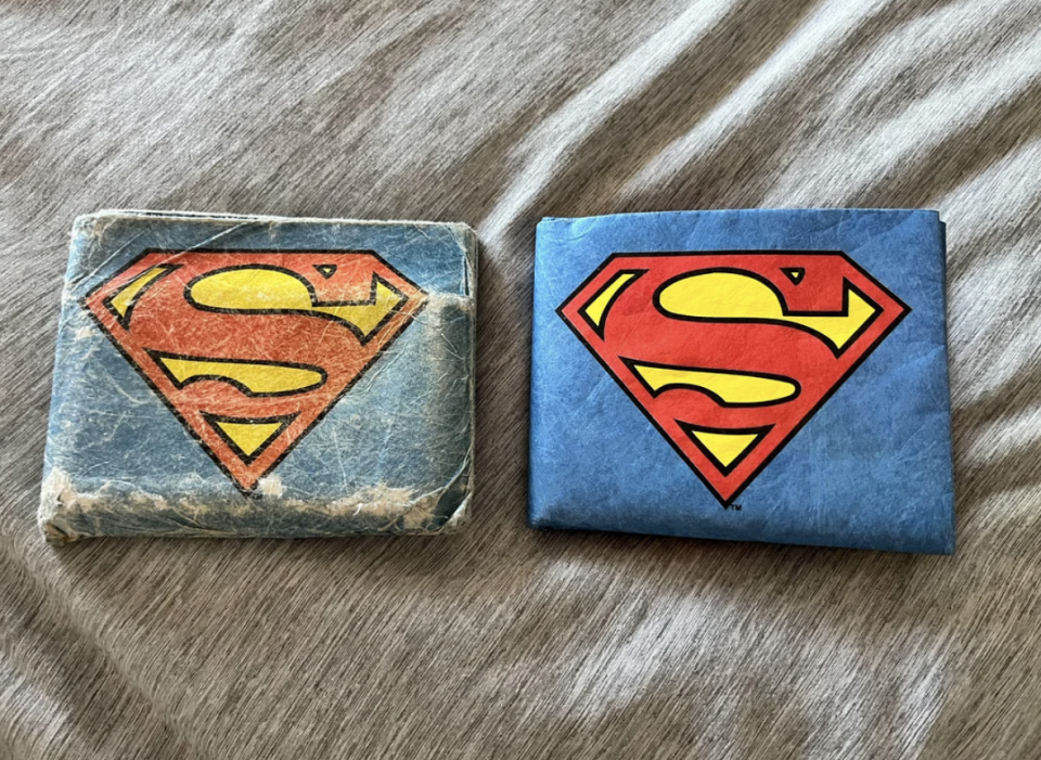 The old "Superman" wallet is a faded blue and badly frayed