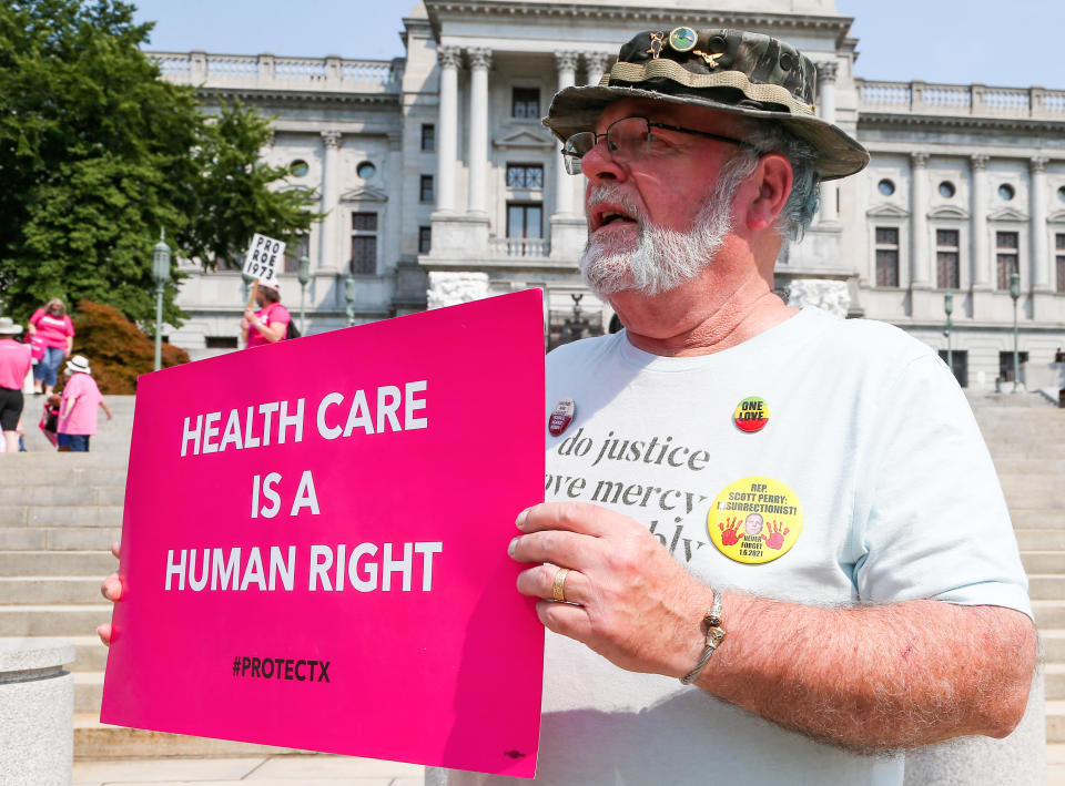 A man holds a placard at the Pennsylvania State Capitol during the Rally for Reproductive Rights.
(Paul Weaver/SOPA Images/LightRocket via Getty Images)