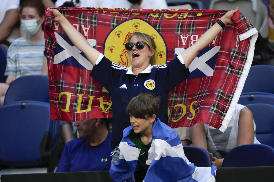 Supporters of Britain's Andy Murray cheer him on during his second round match against Taro Daniel of Japan at the Australian Open tennis championships in Melbourne, Australia, Thursday, Jan. 20, 2022. (AP Photo/Simon Baker)