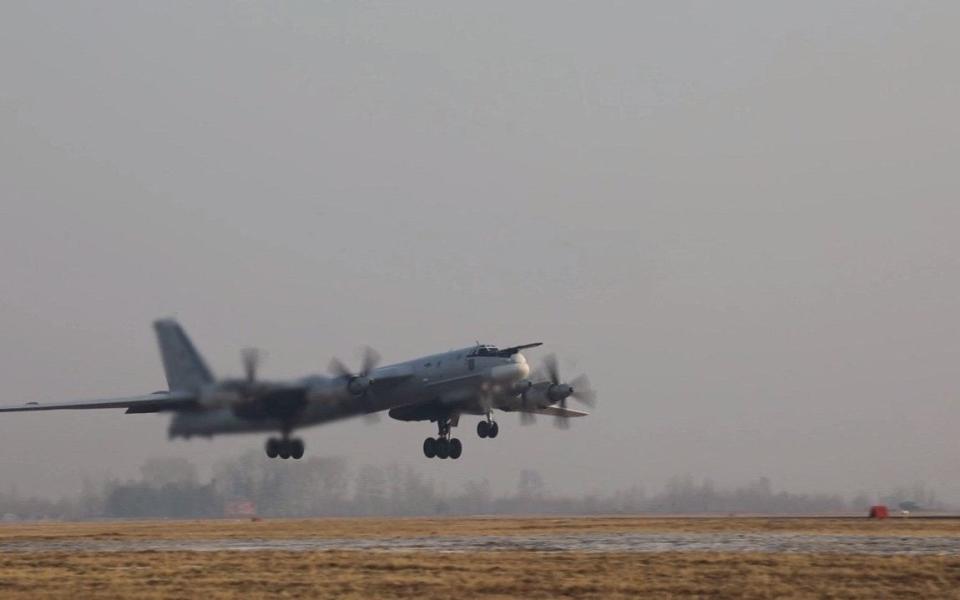 A Russian Tu-95MS strategic bomber takes off in an unknown location to perform a flight over the neutral waters of the Sea of Japan on Tuesday. - RUSSIAN DEFENCE MINISTRY