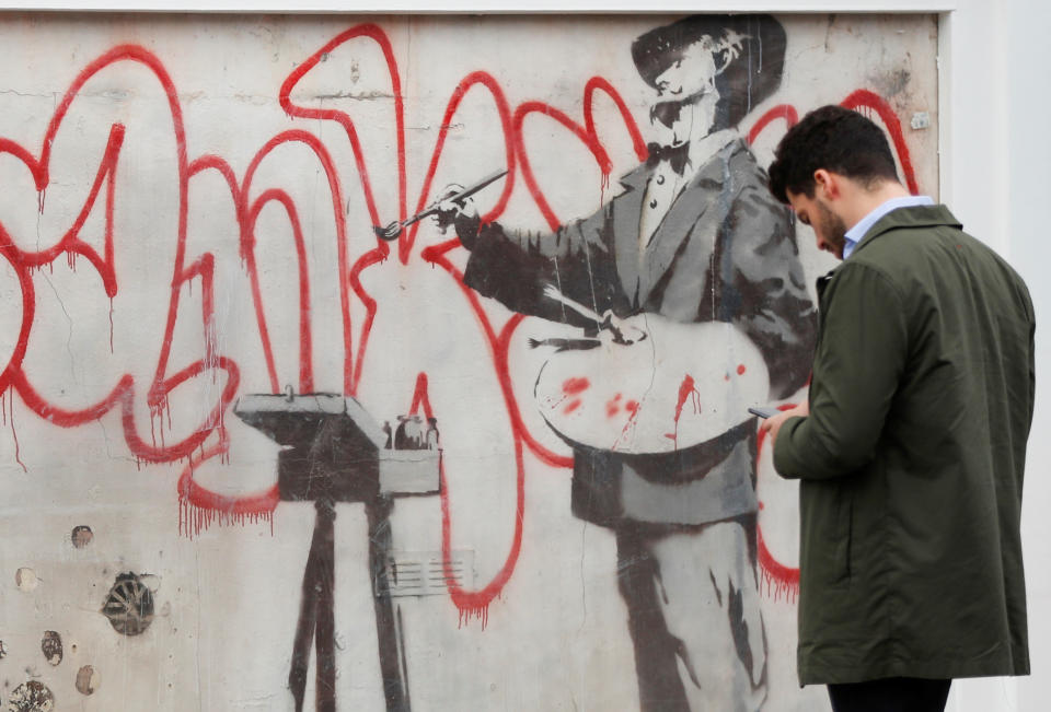 The Banksy mural features an artist believed to be Spanish painter Diego Velazquez (Picture: Reuters)