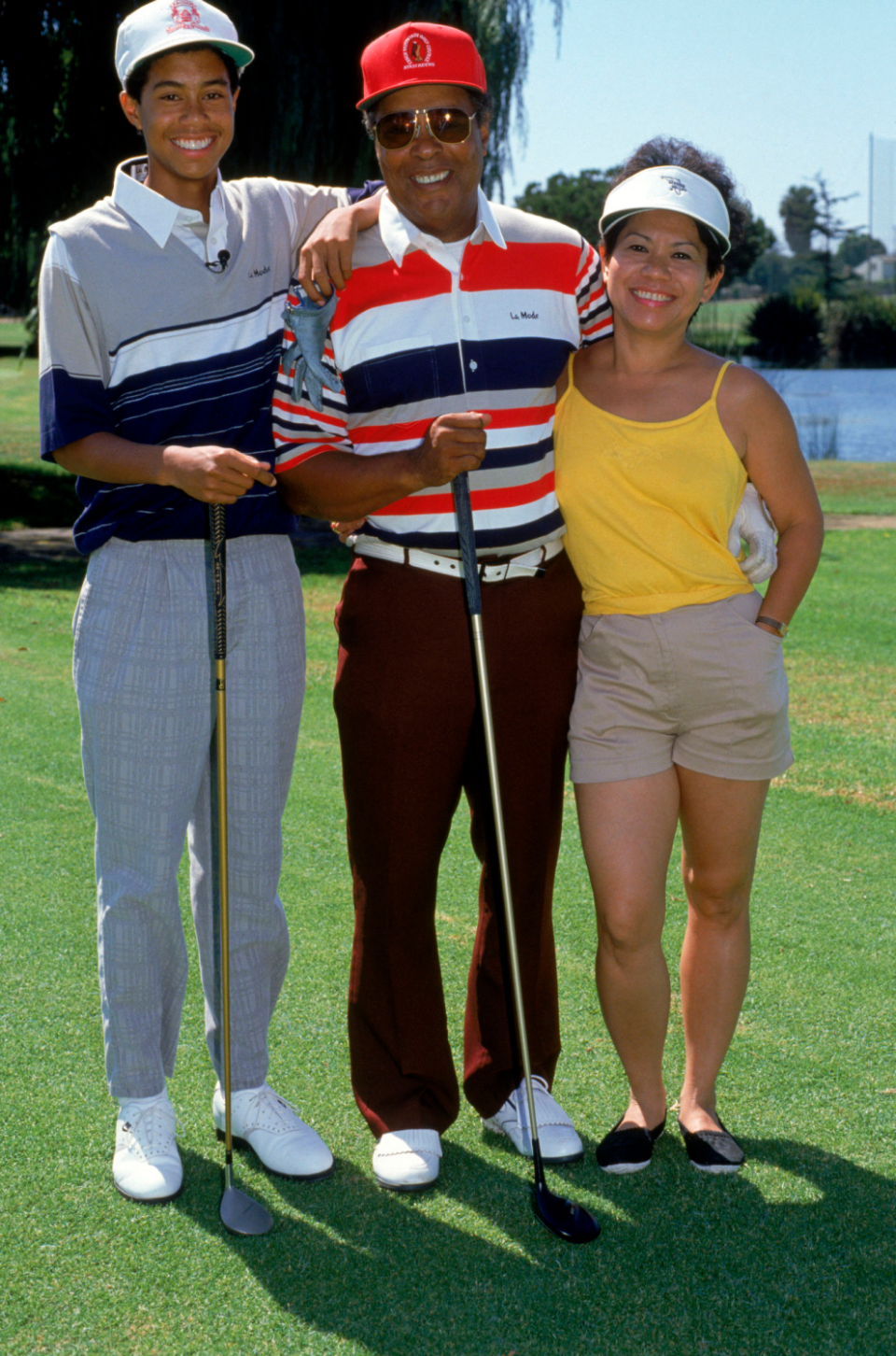 Tiger Woods poses for a photograph with his father, Earl, and mother, Kultida, in September 1990.