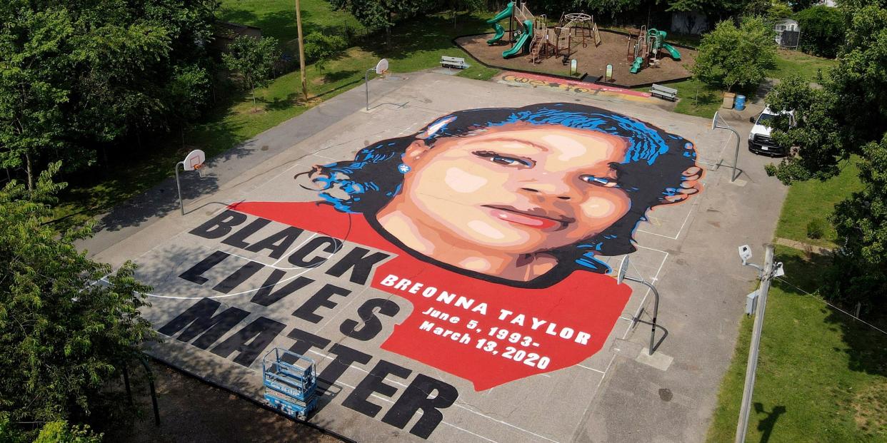 A ground mural depicting a portrait of Breonna Taylor is seen at Chambers Park, Monday, July 6, 2020, in Annapolis, Md. The mural honors Taylor, a 26-year old Black woman who was fatally shot by police in her Louisville, Kentucky, apartment. The artwork was a team effort by the Banneker-Douglass Museum, the Maryland Commission on African American History and Culture, and Future History Now, a youth organization that focuses on mural projects. (AP Photo/Julio Cortez)