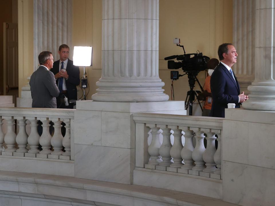 Reps. Kelly Armstrong and Adam Schiff do simultaneously TV hits from the Cannon rotunda in July 2021.