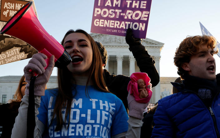 A anti-abortion demonstrator protests in front of the Supreme Court building, on the day of hearing arguments in the Mississippi abortion rights case Dobbs v. Jackson Women's Health, in Washington, U.S., December 1, 2021. <span class="copyright">REUTERS/Jonathan Ernst</span>