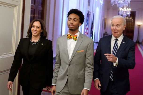 PHOTO: President Joe Biden and Vice President Kamala Harris arrive with DuWayne Portis Jr., a youth leader at Chicago Youth Service Corps, center, to speak at an event to celebrate Black History Month, Feb. 27, 2023, at the White House in Washington. (Alex Brandon/AP)