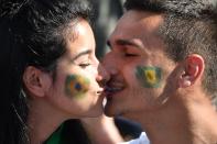 Brazil supporters kiss prior to the France 2019 Women's World Cup Group C football match between Australia and Brazil, on June 13, 2019, at the Mosson Stadium in Montpellier, southern France. (Photo by Pascal Guyot/AFP/Getty Images)