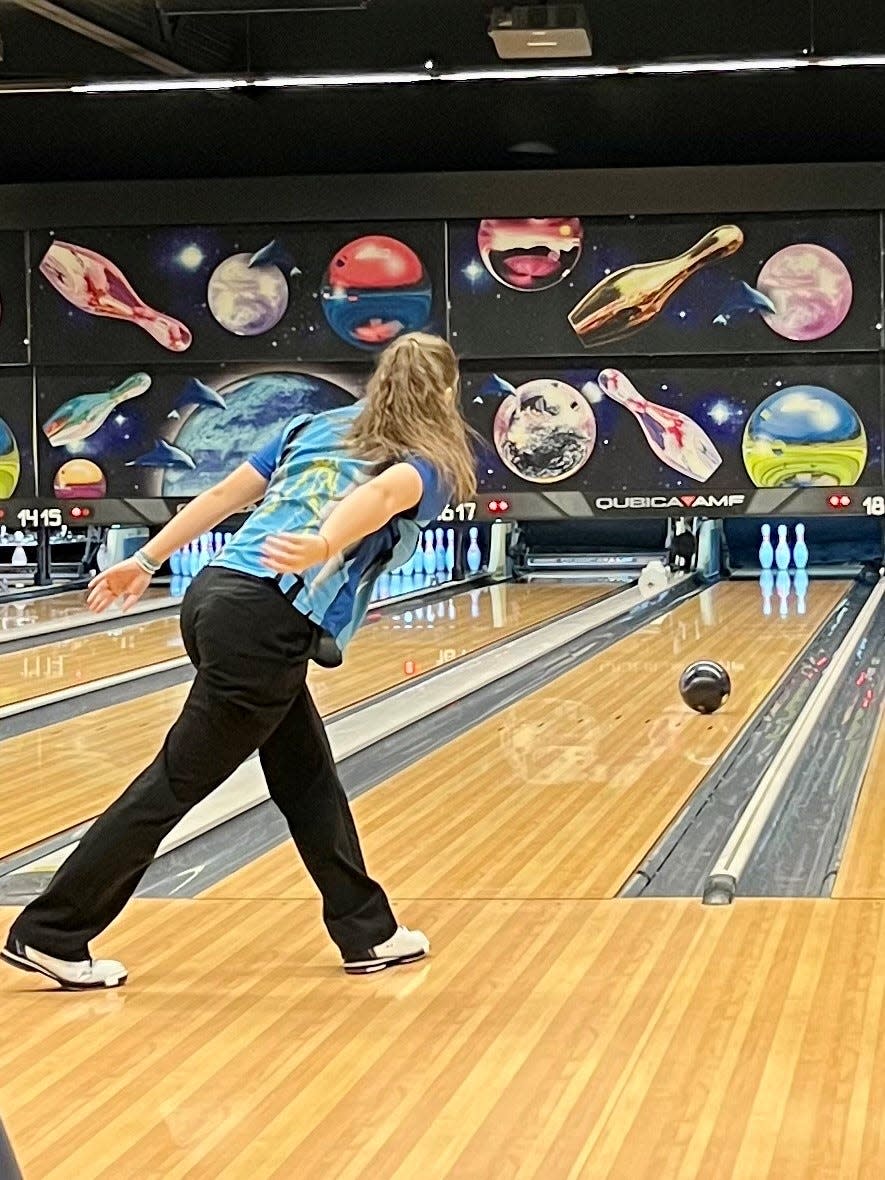 River Valley's Alexis Manning watches a shot during a girls bowling match with Pleasant at BlueFusion Entertainment last week.