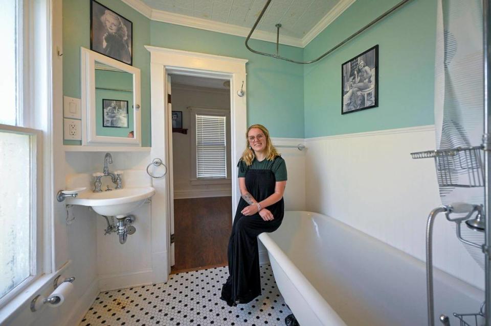 Christina Vogler said she likes to think that Ginger Rogers once bathed in this tub or used the sink, which are both original to the 1906 house. Photos of Rogers hang on the wall from the time when the home was a museum.