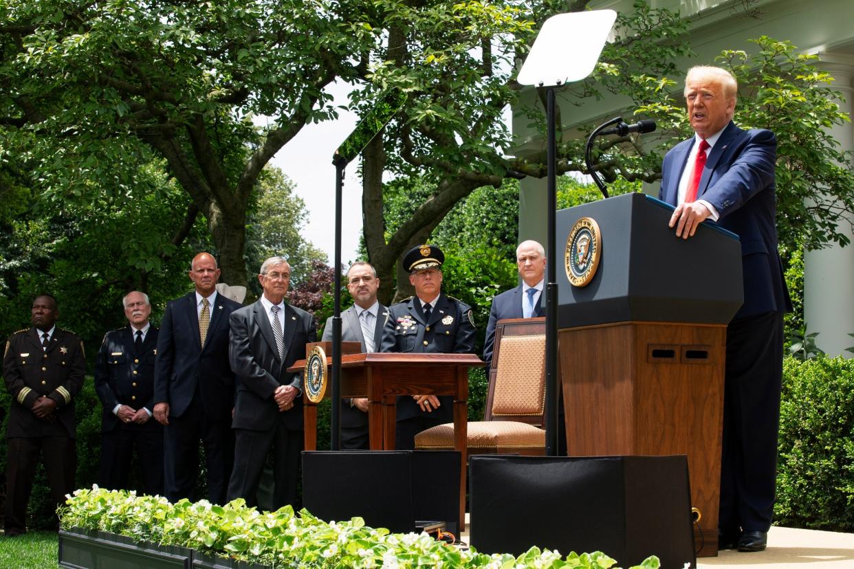 Donald Trump speaks at the signing of an executive order on police reform: EPA