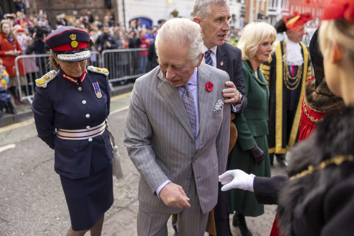 Britain's King Charles III reacts after an egg was thrown in his direction during a ceremony at Micklegate Bar in York, northern England on November 9, 2022 as part of a two-day tour of Yorkshire. - Micklegate Bar is considered to be the most important of York's gateways and has acted as the focus for various important events. It is the place The Sovereign traditionally arrives when entering the city. (Photo by James Glossop / POOL / AFP)