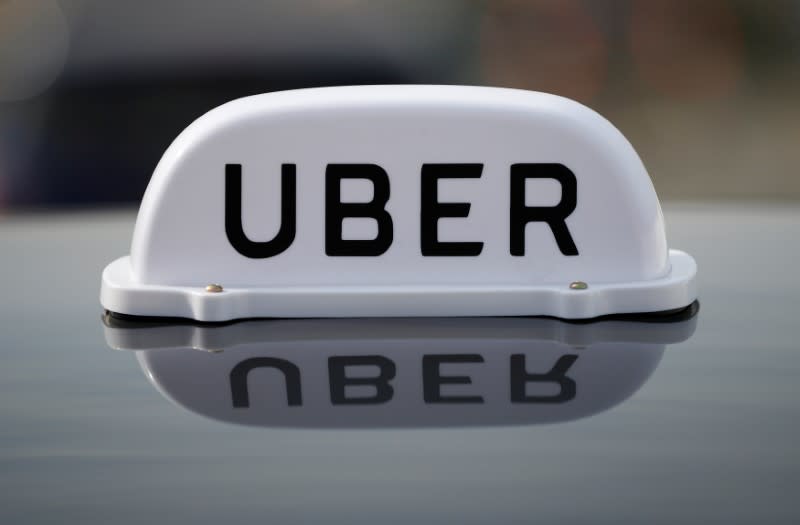 The Logo of taxi company Uber is seen on the roof of a private hire taxi in Liverpool, Britain, April 15, 2019. REUTERS/Phil Noble