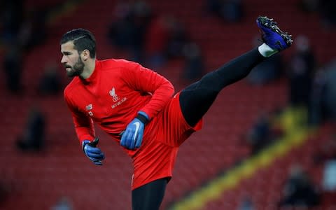 Alisson during the warm up - Credit: Reuters