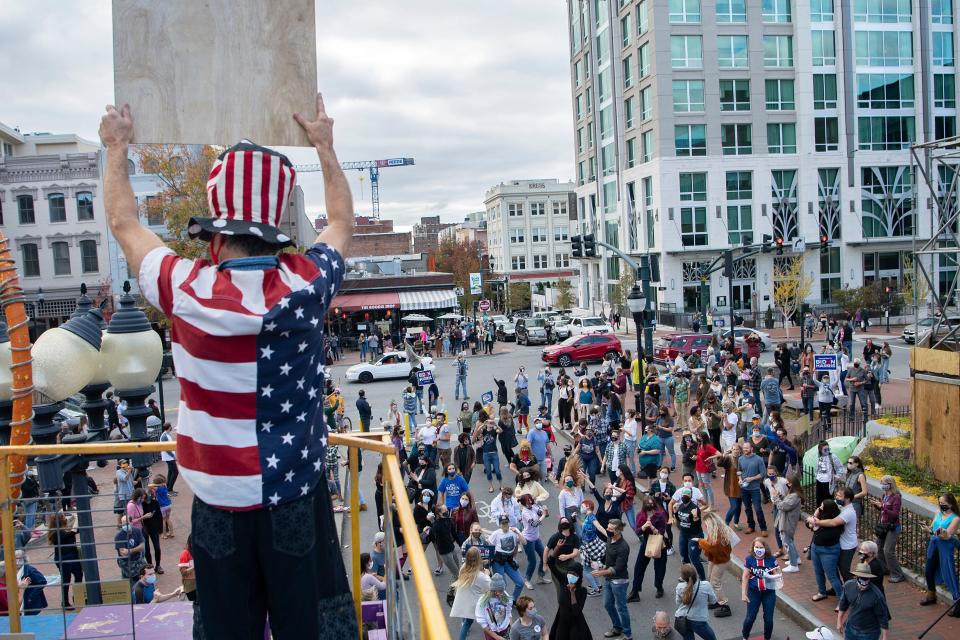 Hundreds gathered around the Vance Monument in downtown Asheville to celebrate as passing cars honked in approval after the 2020 presidential election was called for Joe Biden on Nov. 7, 2020. 