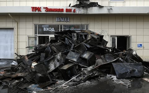 The site of a fire at the Zimnyaya Vishnya shopping centre  - Credit: Maxim Grigoryev /TASS/Getty