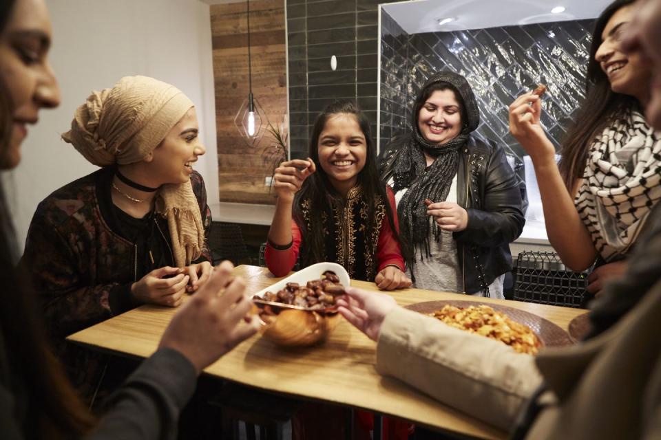 family eating iftar and enjoying breaking of fasting