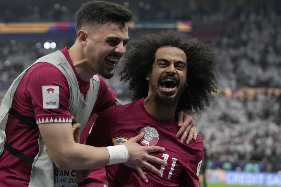 Qatar's Akram Afif celebrates after scoring his third goal during the Asian Cup final soccer match between Qatar and Jordan at the Lusail Stadium in Lusail, Qatar, Saturday, Feb. 10, 2024. (AP Photo/Thanassis Stavrakis)