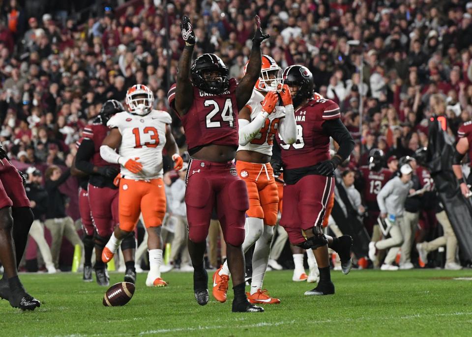 South Carolina running back Mario Anderson (24) reacts after a first down near Clemson defensive tackle Tyler Davis (13) during the first quarter Nov 25, 2023; Columbia, South Carolina, USA; at Williams-Brice Stadium.