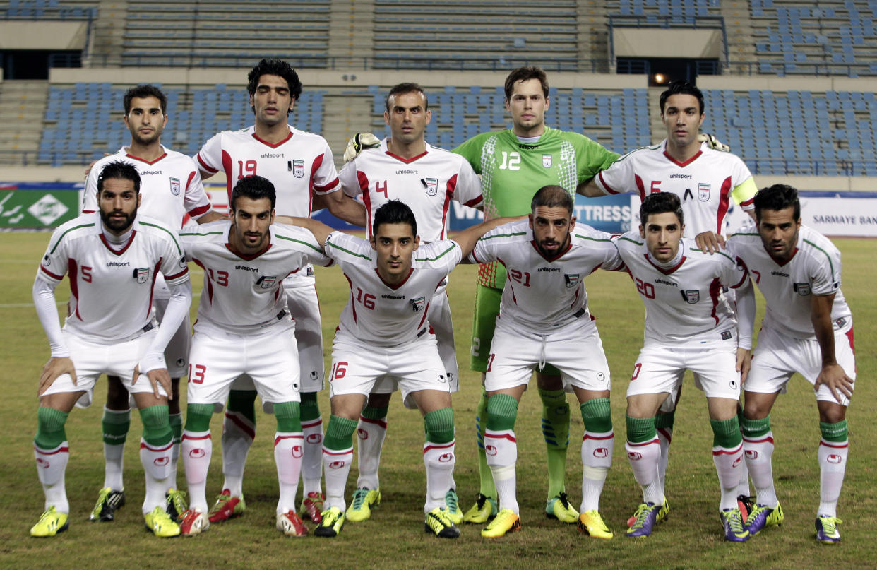 FILE - In this Nov. 19, 2013 file photo, Iran national team poses prior to the start the AFC Asian Cup 2015 qualifying soccer match between Lebanon and Iran in Beirut, Lebanon. Foreground from left: Amirhossein Sadeghi, Hossein Mahini, Reza Ghoochannejhad Nournia, Ashkan Dejagah, Alireza Jahan Bakhsh and Masoud Shojaei. Background from left: Mehrdad Beitashour, Reza Haghighi, Jalal Hosseini, Mohammed Davari and Javad Nekonam.  (AP Photo/Bilal Hussein, File)