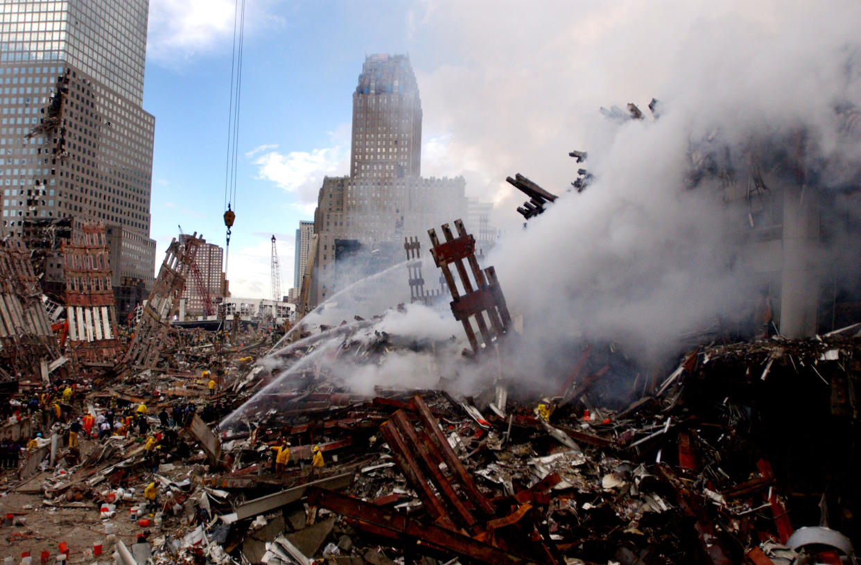Fires burn amidst the rubble of the World Trade Center on September 13, 2001, days after the September 11, 2001 terrorist attack. (U.S. Navy Photo by Jim Watson/Getty Images)