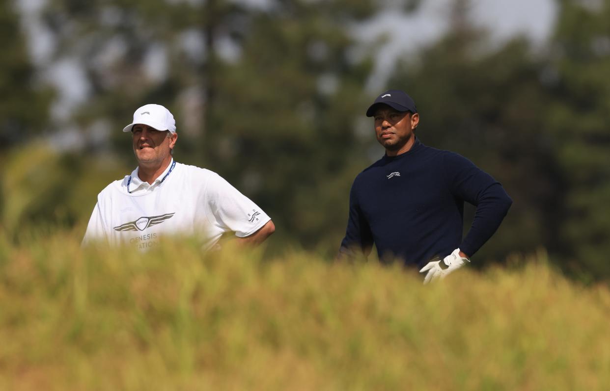 Tiger Woods of the United States and caddie Lance Bennett prepare to play a shot during the second round of The Genesis Invitational at Riviera Country Club on February 16, 2024 in Pacific Palisades, California. (Photo by Sean M. Haffey/Getty Images)