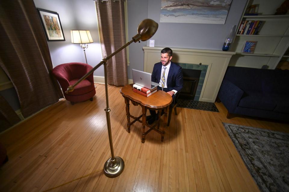 Rep. Dan Wolgamott prepares for people to join an emergency virtual town hall from his living room Monday, Nov. 30, 2020, in St. Cloud. 