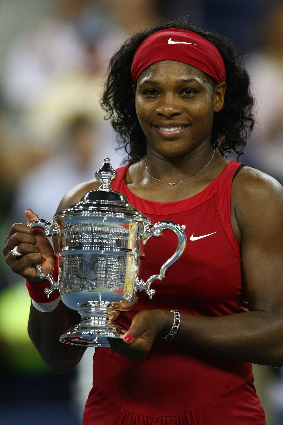 Serena Williams of the United States poses with the championship trophy after defeating Jelena Jankovic of Serbia in the women's singles finals on Day 14 of the 2008 U.S. Open at the USTA Billie Jean King National Tennis Center on September 7, 2008 in the Flushing neighborhood of the Queens borough of New York City. (Photo by Chris McGrath/Getty Images)