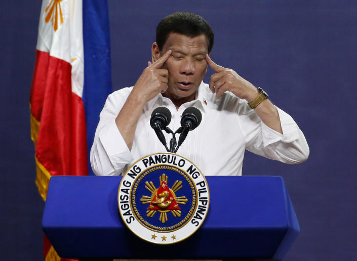 FILE - In this Tuesday Aug. 27, 2019 file photo Philippine President Rodrigo Duterte gestures as he addresses land reform beneficiaries on the 31st year of the implementation of the Comprehensive Agrarian Reform Program (CARP) in suburban Quezon city northeast of Manila, Philippines. International Criminal Court judges on Wednesday Sept. 15, 2021, authorized an investigation into the Philippines' deadly "war on drugs" campaign, saying the crackdown "cannot be seen as a legitimate law enforcement operation." (AP Photo/Bullit Marquez, File)