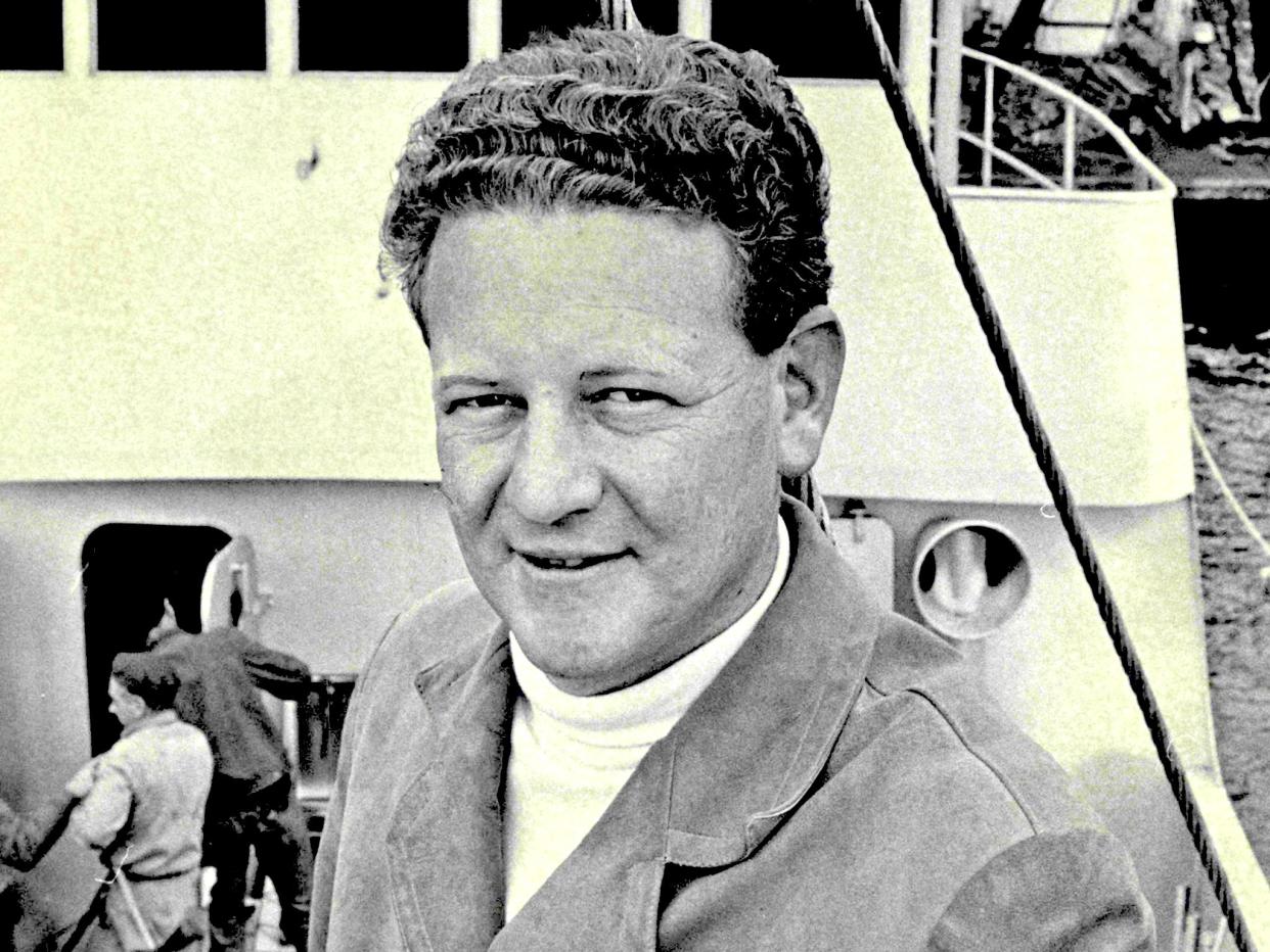 <p>Warner aboard his fishing boat in 1967</p> (Fairfax/Getty)