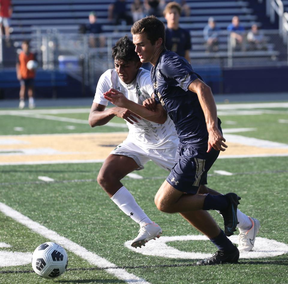 Armaan Ararwal of Montville fights for the ball with Gabriel Ruitenberg of Roxbury as Roxbury topped Montville 6-1 in NJAC-American boys soccer played in Roxbury, NJ on September 21, 2022.