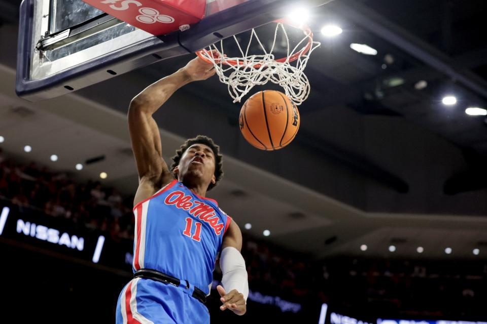 FILE - Mississippi guard Matthew Murrell dunks during the first half of an NCAA college basketball game against Auburn, Feb. 23, 2022, in Auburn, Ala. Led by guards Daeshon Ruffin and Murrell, Mississippi is trying to improve on a 13-19 record that included only four Southeastern Conference wins. (AP Photo/Butch Dill, File)