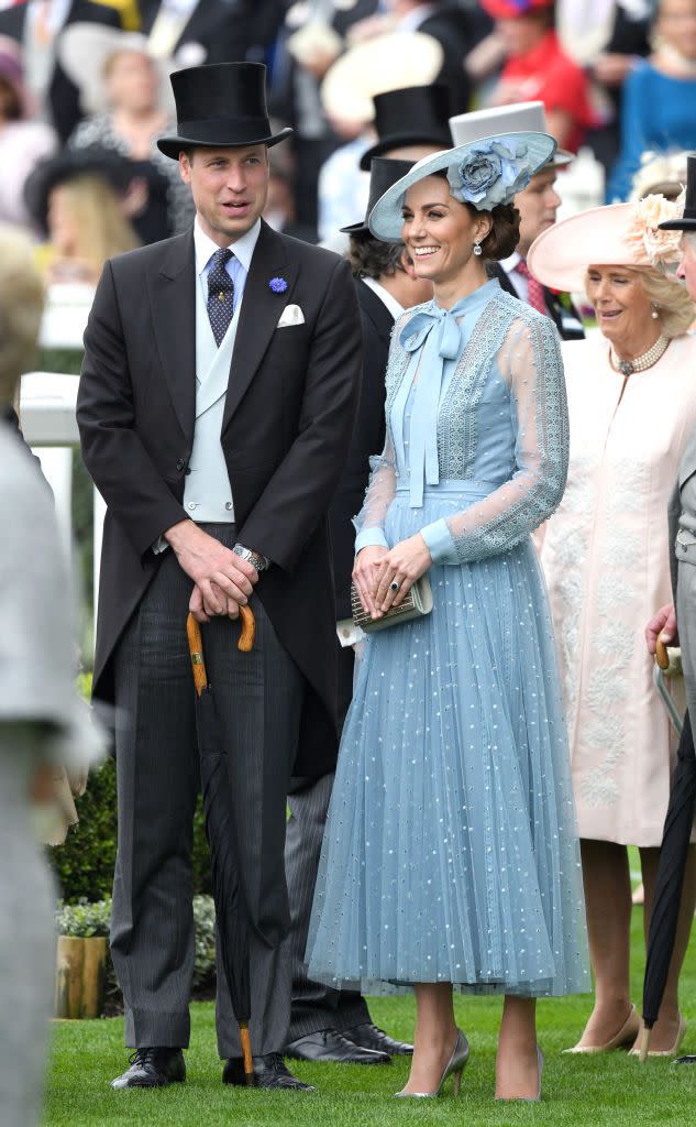 <p>Prince William, Duke of Cambridge and Catherine, Duchess of Cambridge wore coordinating blue outfits for day one of the Royal Ascot. (Check out his vest and boutonniere!)</p>