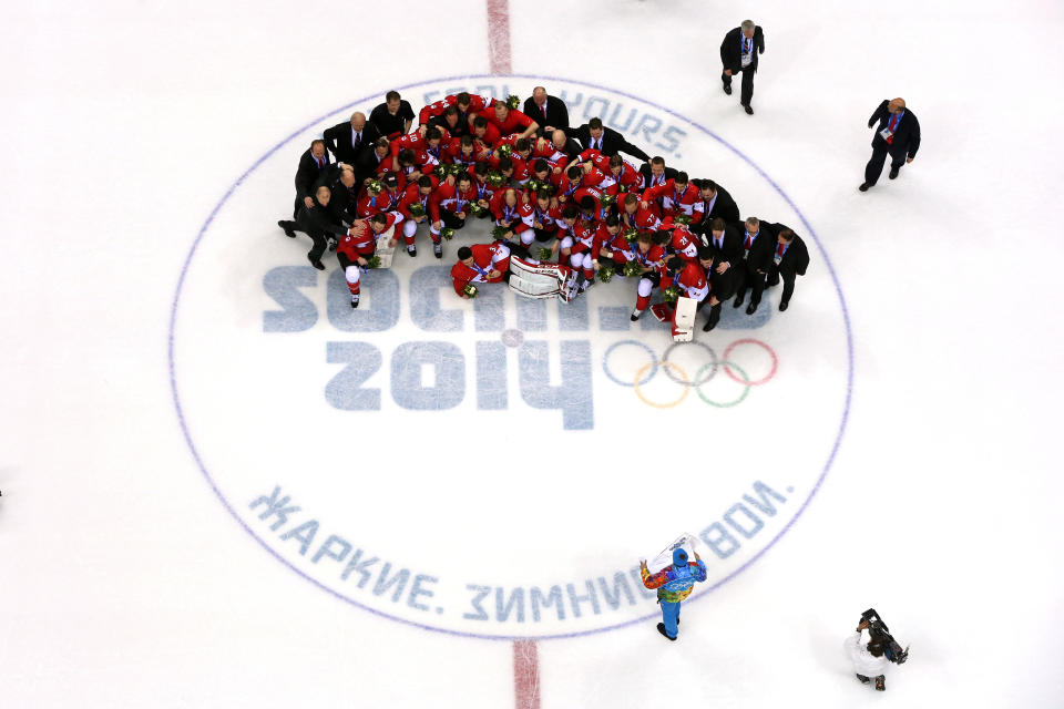 SOCHI, RUSSIA - FEBRUARY 23:  The Canada team pose with the gold medals won during the Men's Ice Hockey Gold Medal match against Sweden on Day 16 of the 2014 Sochi Winter Olympics at Bolshoy Ice Dome on February 23, 2014 in Sochi, Russia.  (Photo by Bruce Bennett/Getty Images)