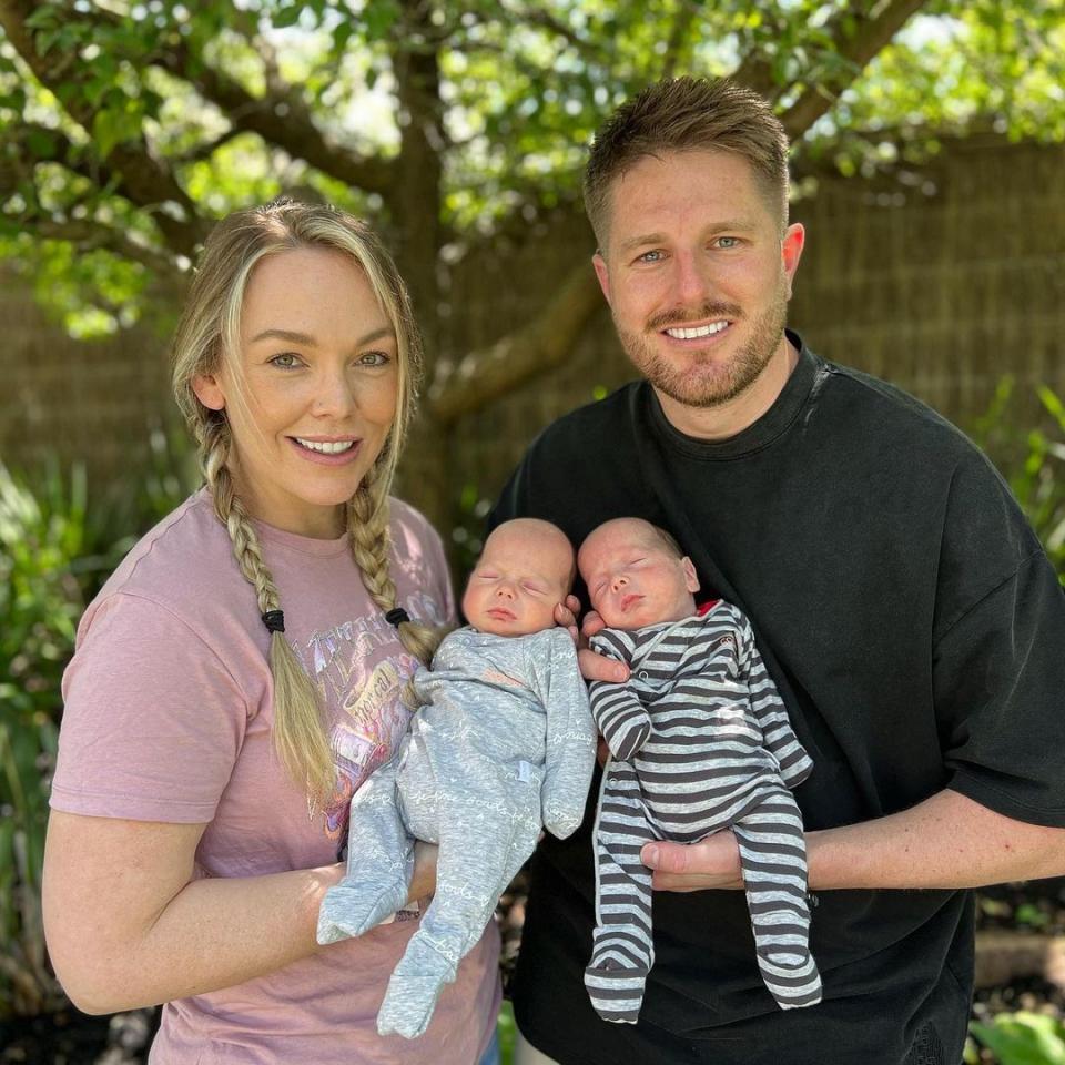 Melissa Rawson and Bryce Ruthven pose with twins