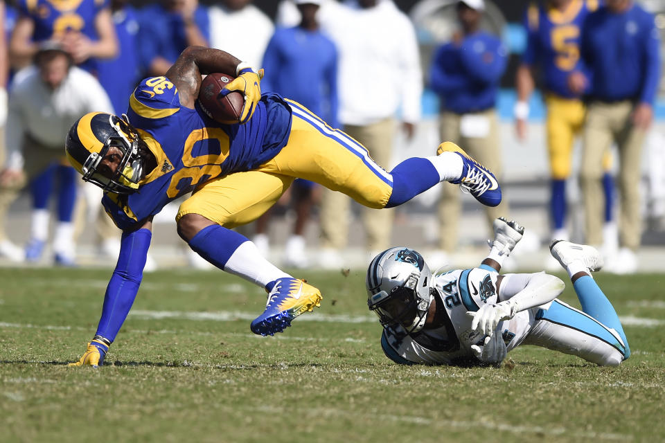 Los Angeles Rams running back Todd Gurley (30) is tripped up by Carolina Panthers cornerback James Bradberry. (AP)