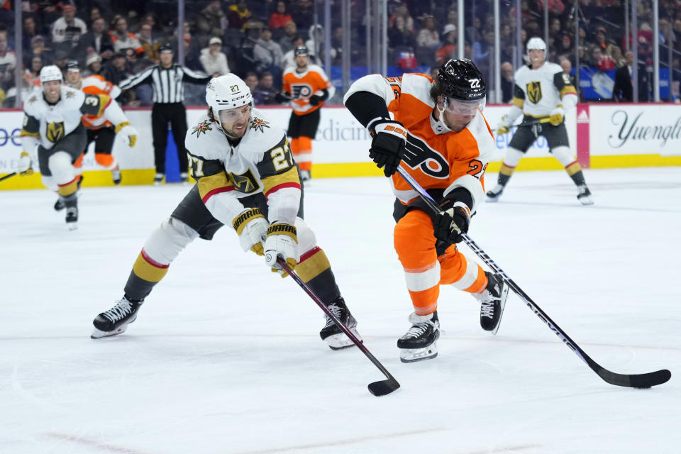 Philadelphia Flyers' Brendan Lemieux, right, tries to get past Vegas Golden Knights' Shea Theodore during the second period of an NHL hockey game, Tuesday, March 14, 2023, in Philadelphia. (AP Photo/Matt Slocum)