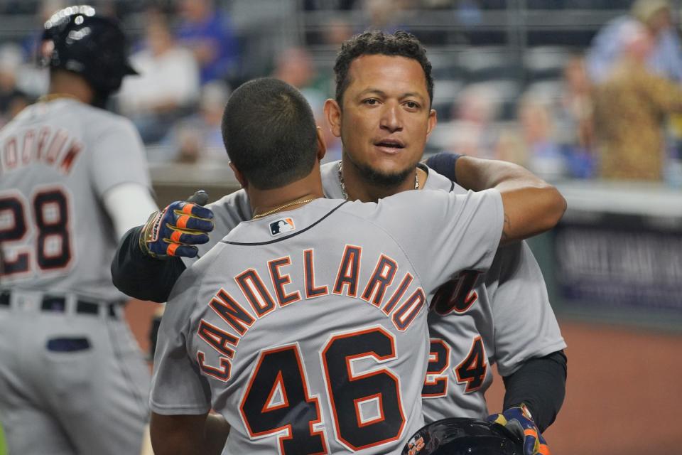 Detroit Tigers first baseman Miguel Cabrera (24) celebrates with third baseman Jeimer Candelario (46) after hitting a grand slam in the seventh inning against the Kansas City Royals at Kauffman Stadium in Kansas City, Missouri, on Friday, May 21, 2021.