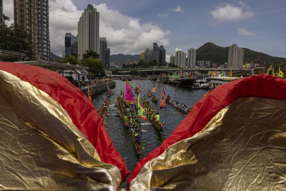 Competitors take part in the annual dragon boat race to celebrate the Tuen Ng festival in Hong Kong, Thursday, June 22, 2023. (AP Photo/Louise Delmotte)